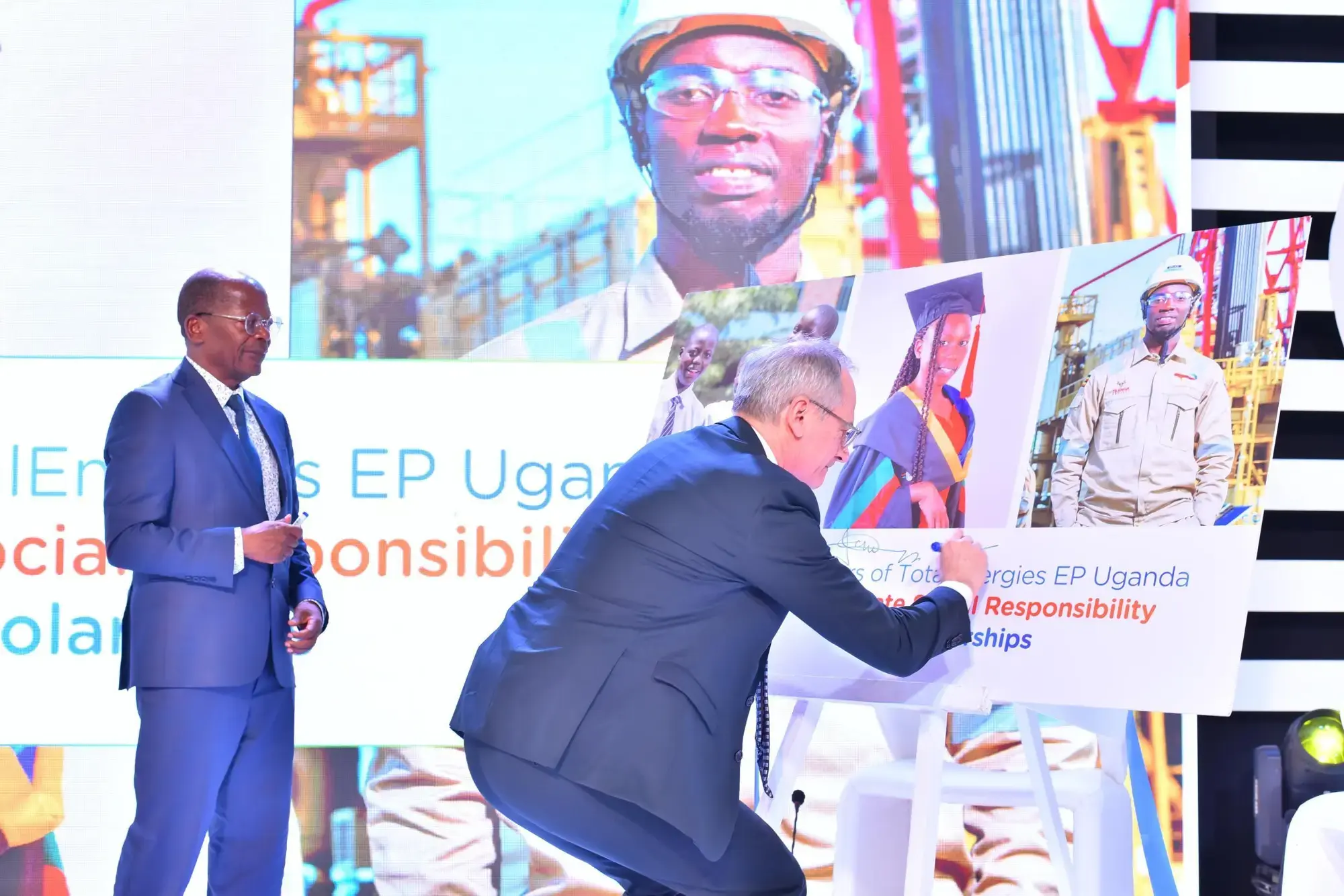 philippe groueix, general manager, totalenergies ep uganda, signs the board at the launch