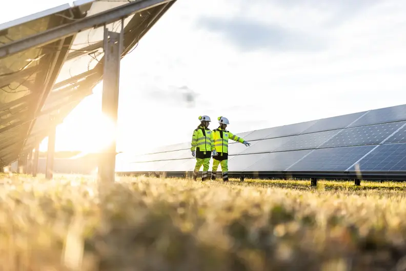 Operator wearing their PPE, on their rounds in the solar farm