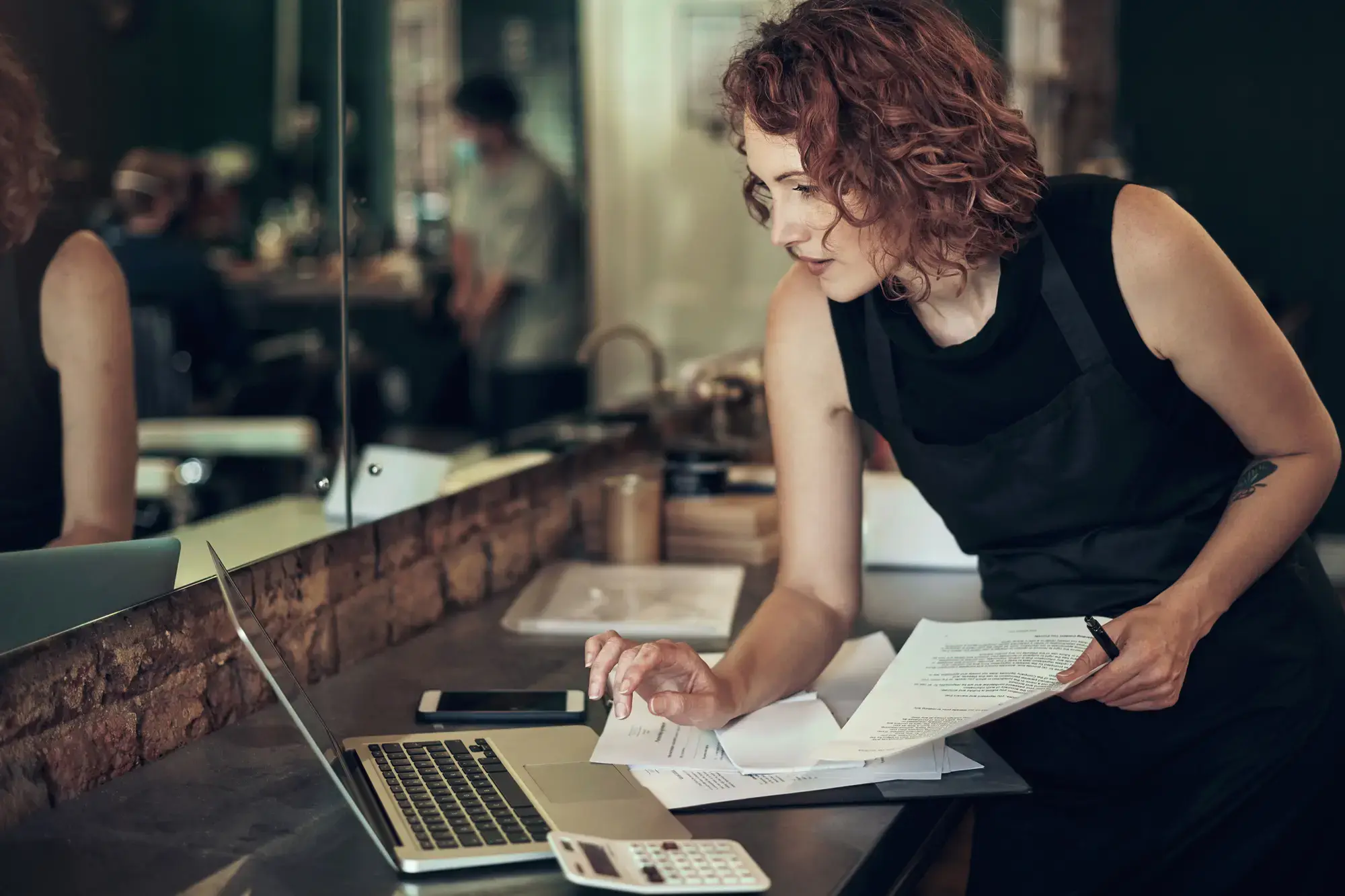Woman paying her bills on a laptop