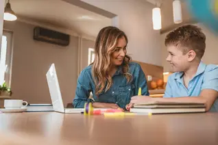 Home Learning PacksMother home schooling her son