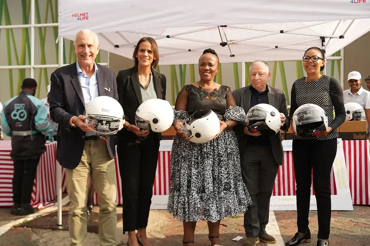 helmets handing out at the TotalEnergies Senderwood service station in Johannesburg - see description hereafter