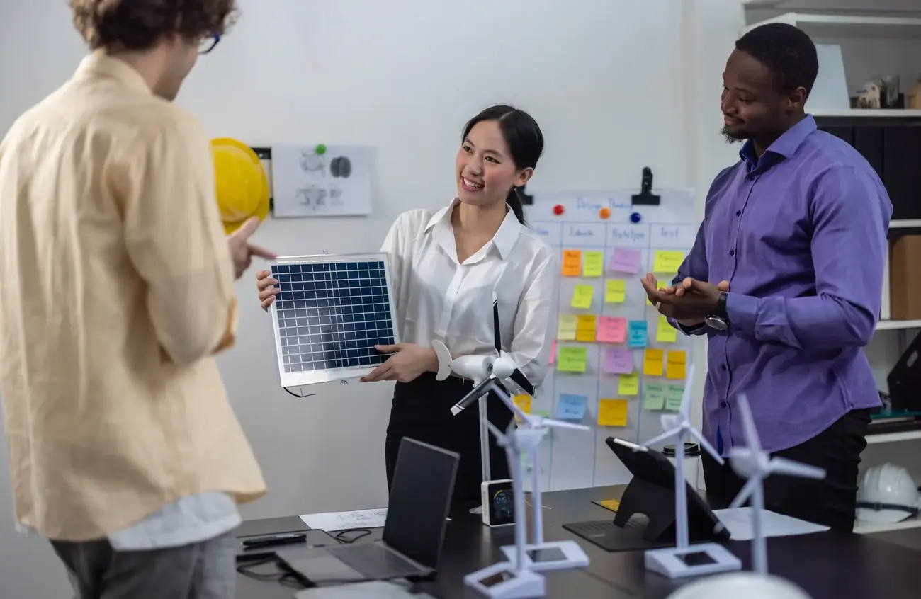 An image of a group of colleagues discussing renewable energy options.