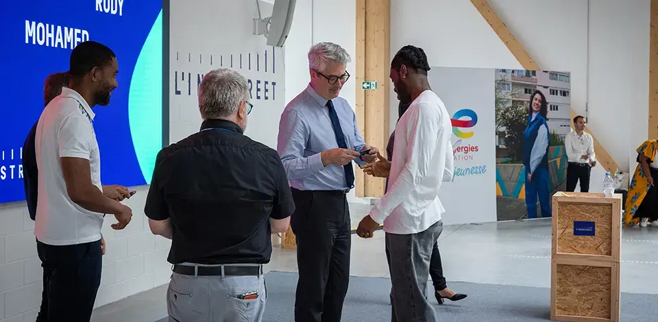 Vincent Lagoguey, Sub-Prefect in Saint-Denis, awards certificates to the students from the Production Line profession.