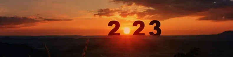 An abstract image of a sunset with 2023 in the foreground.