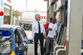 managing_director_of_total_ghana_eric_fanchini_despensing_fuel