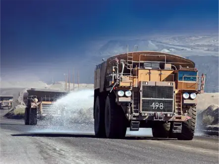 Truck spraying GRT Haul-Loc dust suppressant on the road