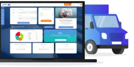 Un ordinateur portable & un camion bleu