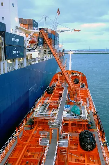 Bunker barge moored to customer vessel