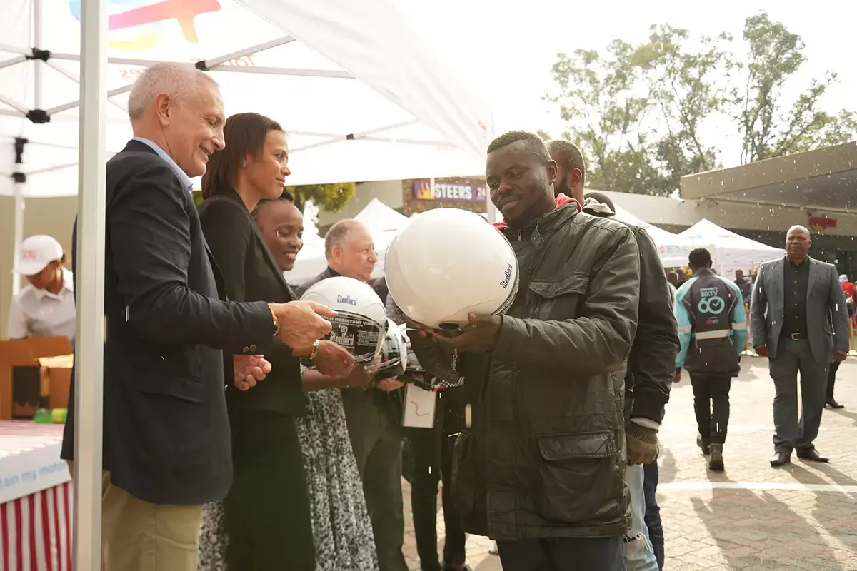 helmets handing out at the TotalEnergies Senderwood service station in Johannesburg - see description hereafter