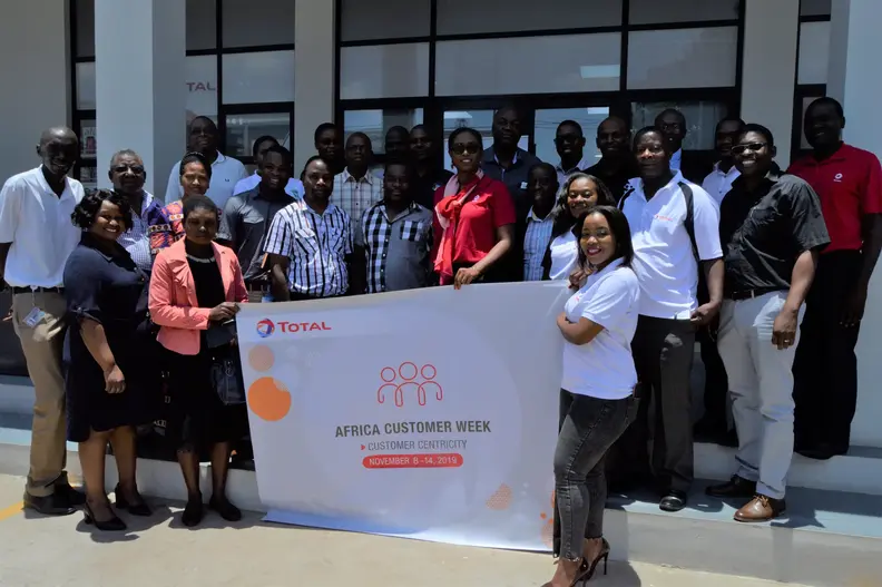Wide shot of Total staff and customers during opening of the Customer Week