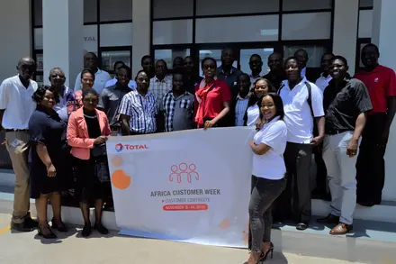 Wide shot of Total staff and customers during opening of the Customer Week