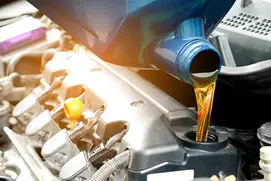 engine oil being poured into a car