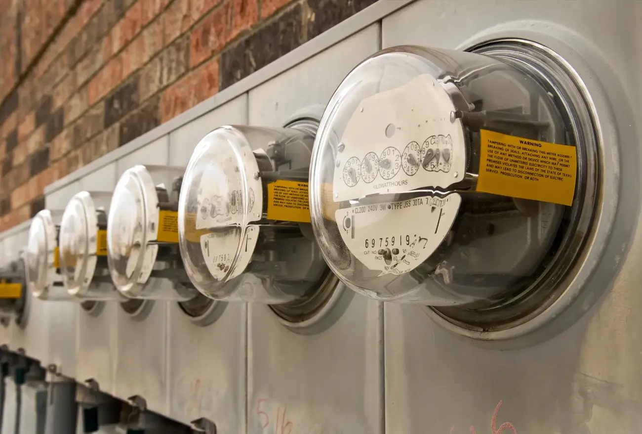 An image showing a row of power meters on an outside wall.