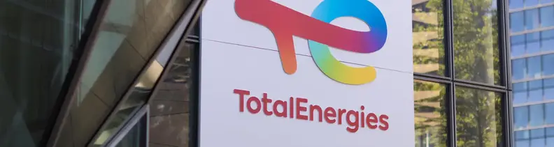 totalenergies logo on a building's window