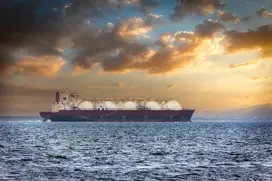 An image showing a tanker shipping LNG across the ocean.