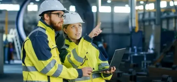 PPE technicians with a computer