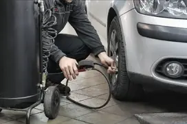 Technician Checking Car Pressure