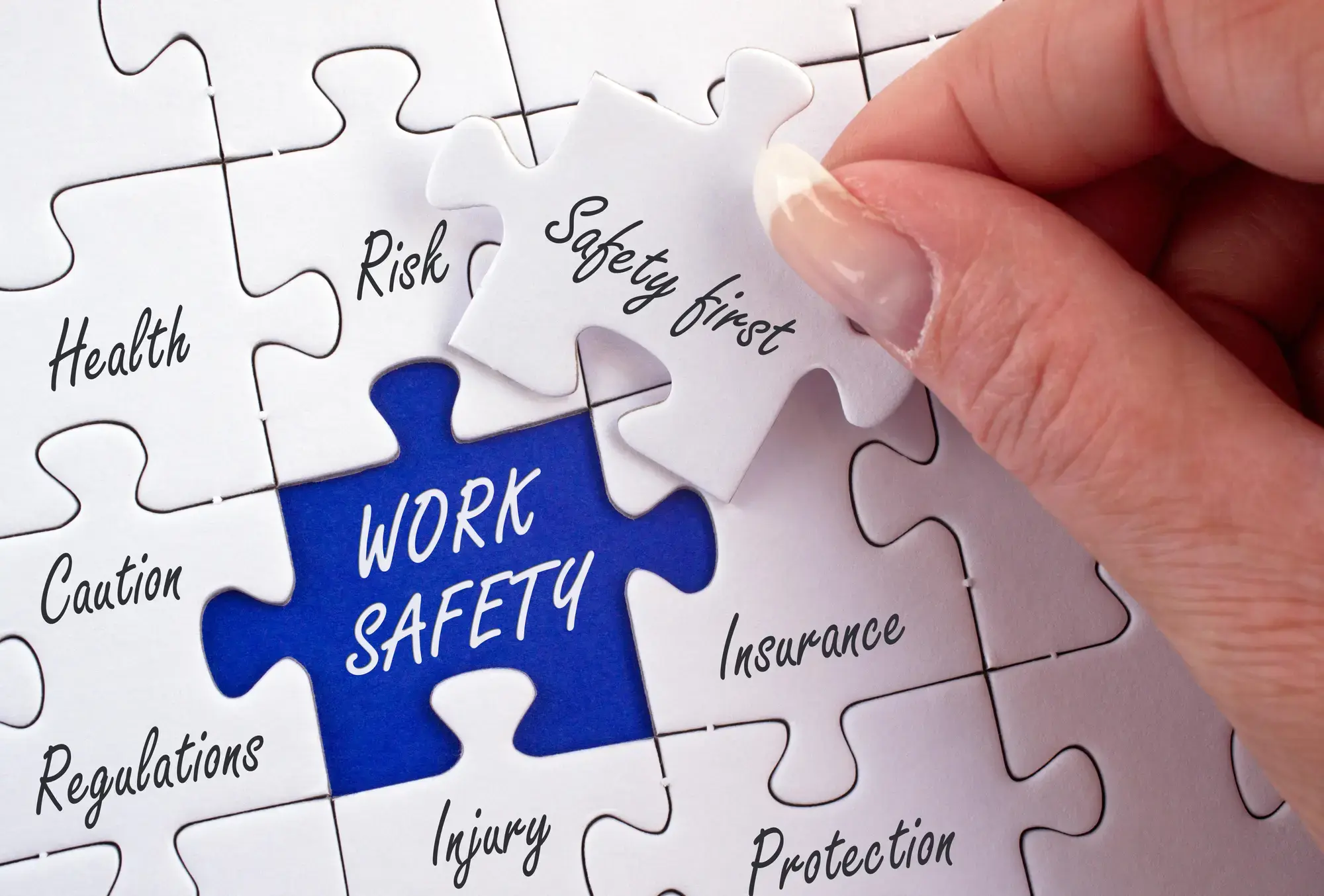 Work Safety Puzzle with female hand and text