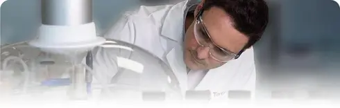 scientist with goggles in a lab