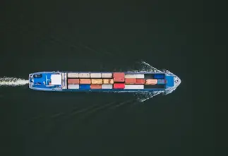 Container ship cutting across the sea