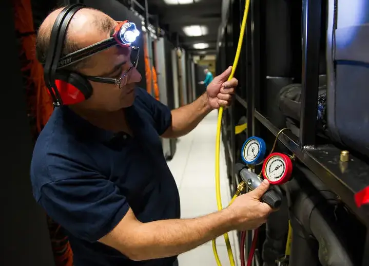 TotalEnergies’s HPC (high performance computer): an operator inspects the cooling distribution unit