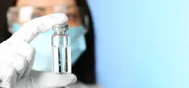 Doctor holding a flask