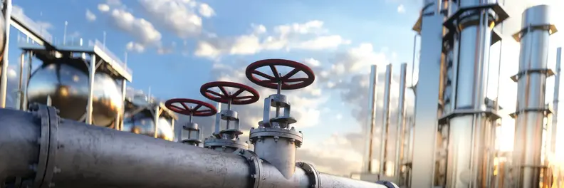Large industrial gas pipeline in a modern refinery at sunrise