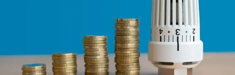 Image of stacking coins next to radiator adjuster