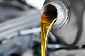 pouring engine oil to motorcycle