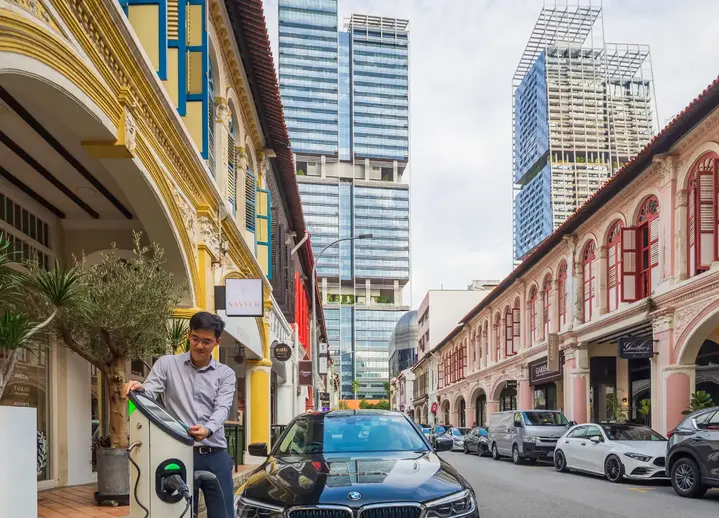 male customer using TotalEnergies EV charging station in Singapore