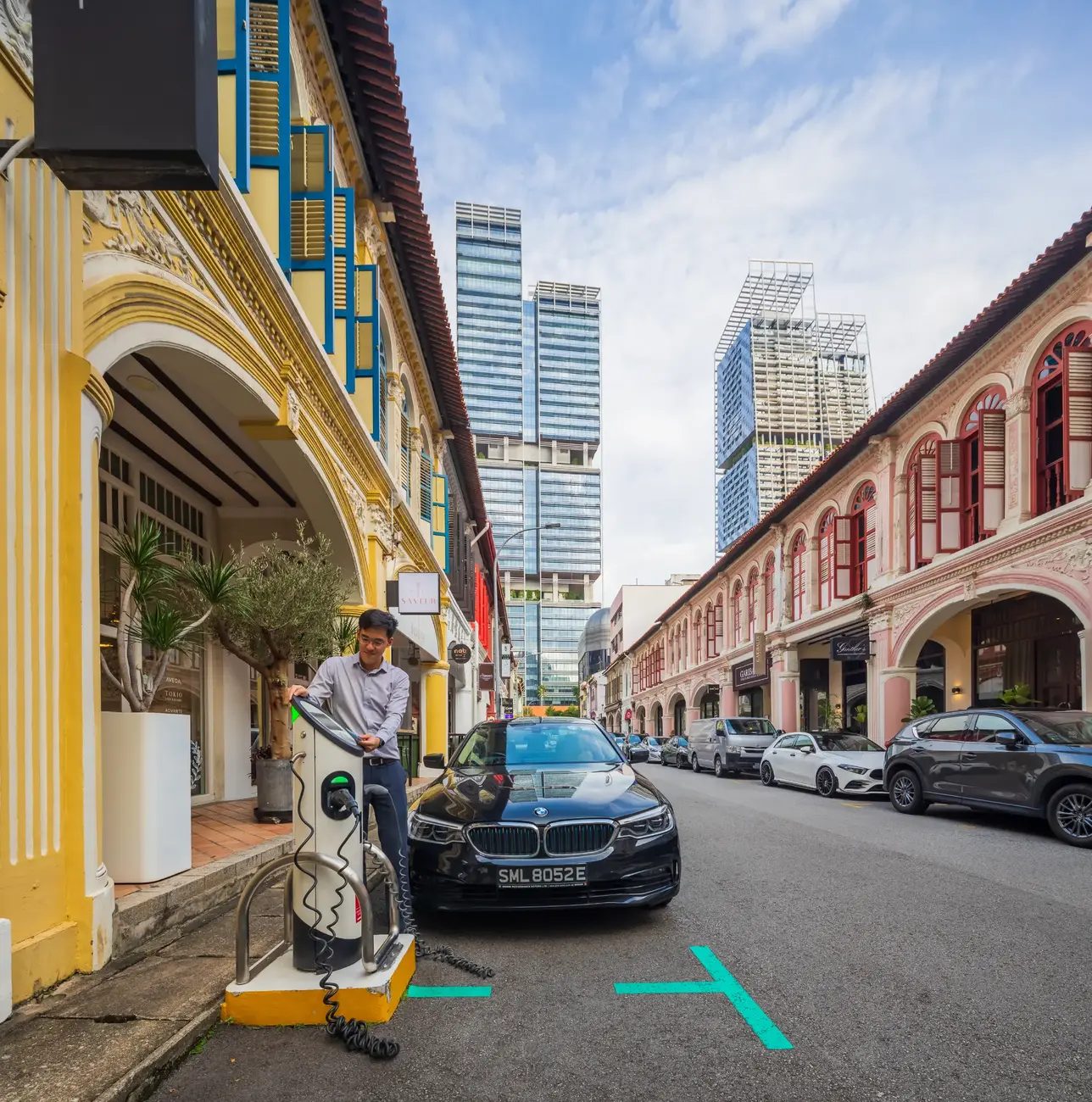 male customer using TotalEnergies EV charging station in Singapore