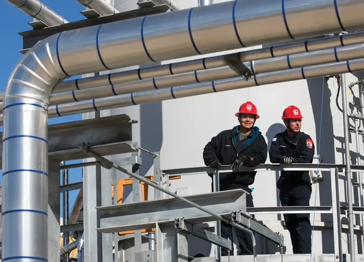 Jason Reyes and Michael Martin, operators, in the special fluids plant in Bayport.