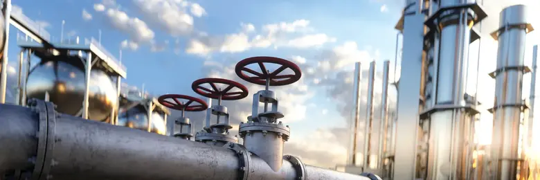 Large industrial gas pipeline in a modern refinery at sunrise